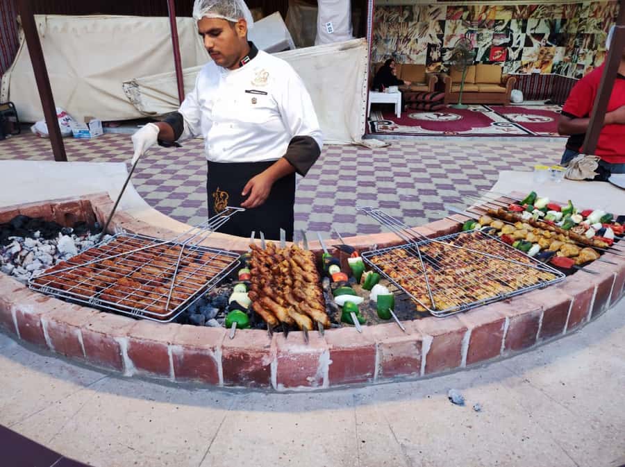 Dubai: Desert Safari Camel Riding, Sandboarding & BBQ Dinner - A short camel ride at sunset