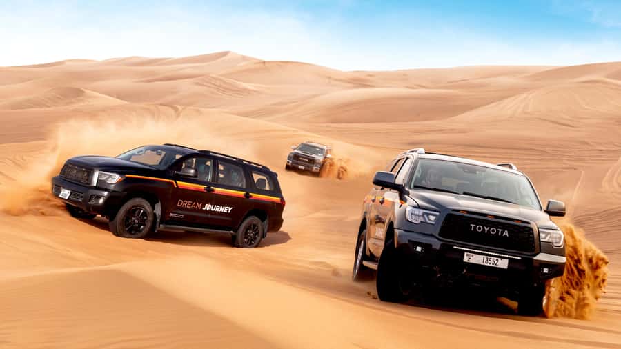 Dubai Desert Safari - Premium BBQ Dinner, Camel Ride & Shows - Sunset at the Bedouin-style camp