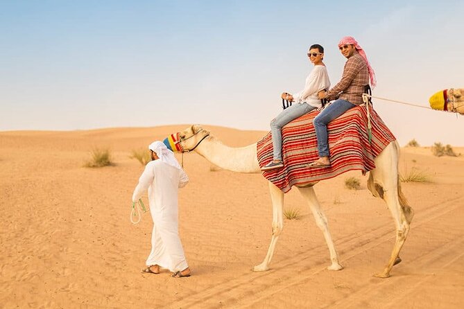 Dubai Desert Safari: Quad Bike, Camel Ride and BBQ Dinner - Quad biking at sunset