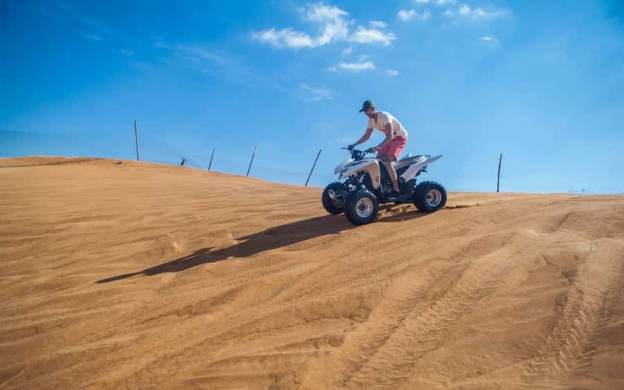 Dubai: Desert Safari, Quad Bike, Camel Ride and Sandboarding - Sandboarding and the high-dune photo stop