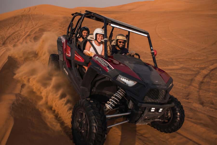 Dubai: Desert Safari, Quad Bike, Sandboarding, Camels & BBQ - From Dubai hotel pickup to the open desert