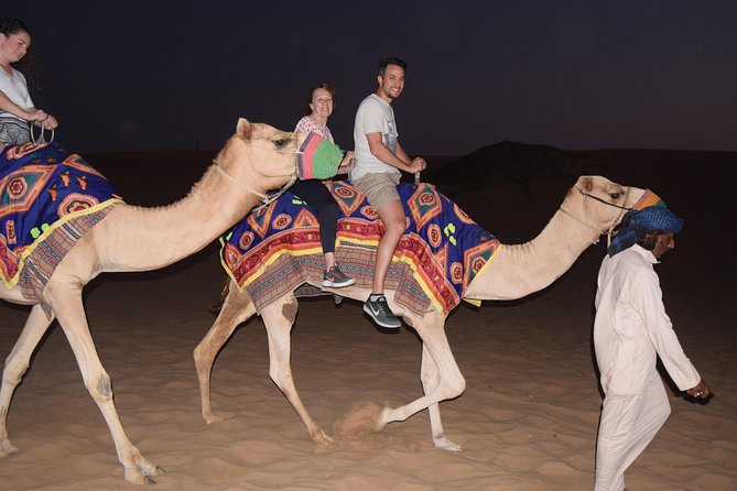 Dubai Desert Safari with BBQ, 3 Shows & Camel Ride at Majlis Camp - Sandboarding, henna, shisha, and Arabic dress