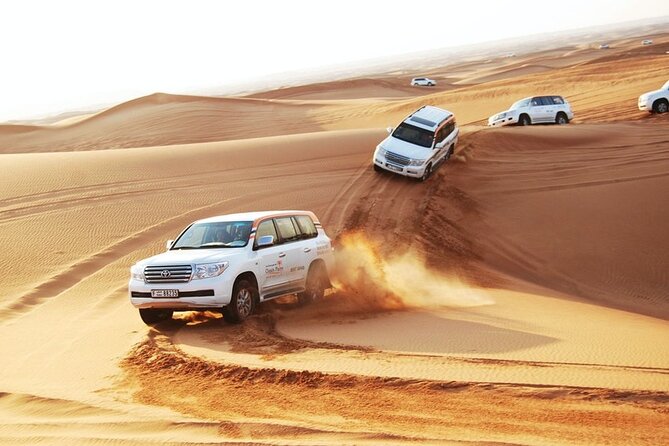 Dubai: Desert Safari with BBQ Dinner - From your Dubai hotel to the open desert