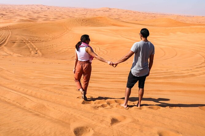 Dubai: Desert Safari with BBQ Dinner - A sunset pause with sandboarding