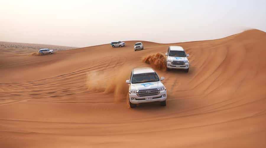Dubai: Desert Safari with Camp, Dinner, & Optional Overnight - From Dubai hotels to the open desert
