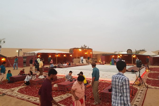 Dubai Desert Safari with Quad Bike, sandboarding, live show & BBQ - The camp evening: camel ride, henna, and costumes