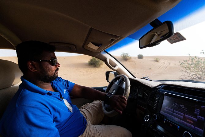 Dubai Desert Safari with Quads, BBQ Dinner, Camel ride, & Shows - Dune bashing: thrilling, scenic, and not gentle