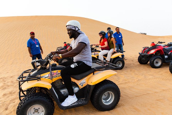 Dubai Desert Safari with Quads, BBQ Dinner, Camel ride, & Shows - Camel riding, sand art, and henna