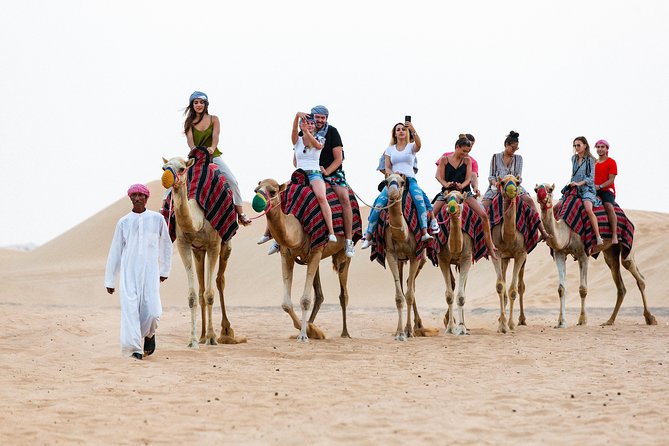 Dubai Desert Safari with Quads, BBQ Dinner, Camel ride, & Shows - Reaching the Bedouin-style camp