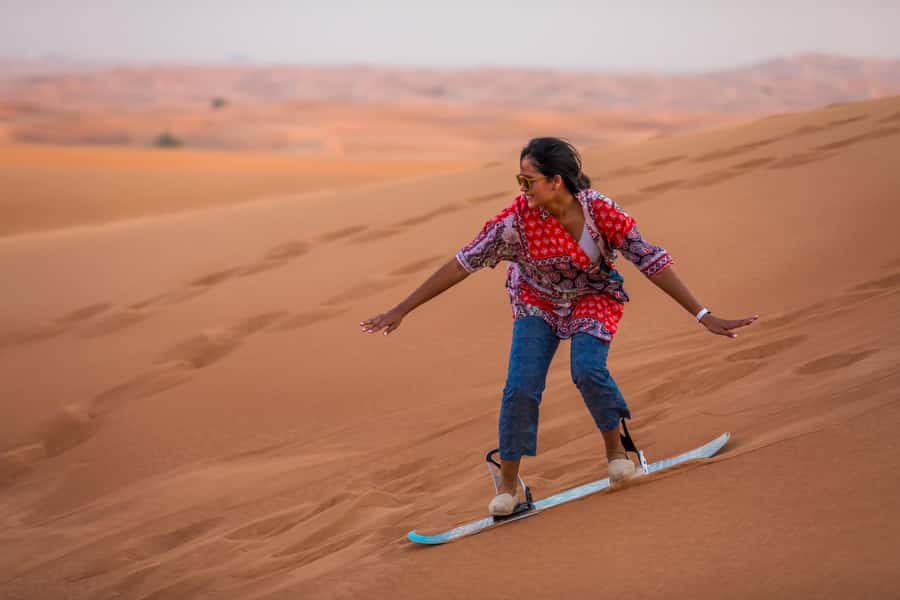 Dubai: Dune Buggy Desert Safari, Camel Ride & Sandboarding - Sandboarding after the engine noise