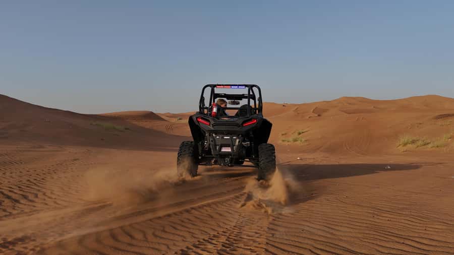 Dubai: Dune Buggy Safari and Camel Ride with Transportation - Sandboarding on the big dunes