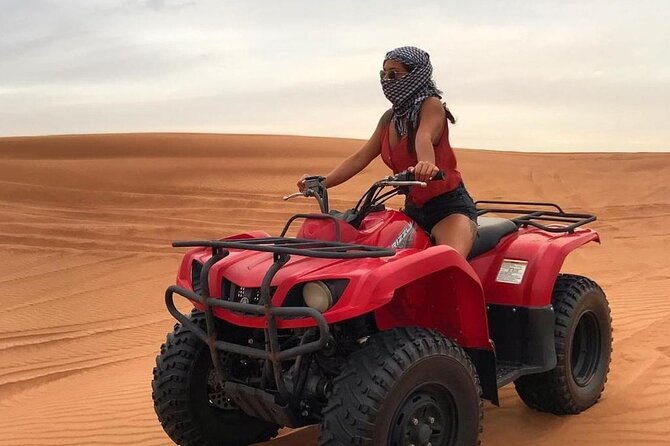 Dubai Dunes Safari With Quad Bike, Camel Ride, BBQ Dinner & Live Shows - Belly dance, tanura, and fire performances