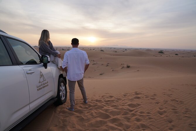 Dubai Evening Desert Safari: Sandboarding, BBQ, Camel Ride & more - Sunset in the Dubai Desert Conservation Reserve