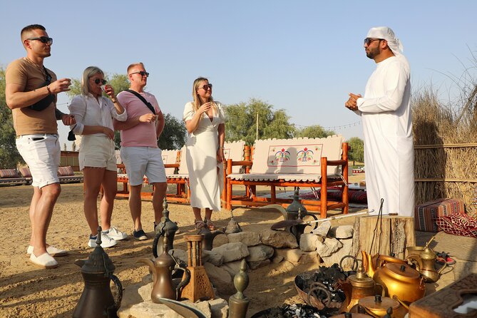 Dubai Evening Heritage Safari by Vintage G Class Al Marmoom Oasis - Arabic coffee, traditional clothing, and the falcon