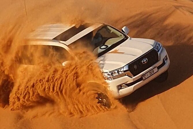 Dubai: Jeep Desert Safari, Camel Ride, and Quad Bike Tour - Quad biking and sandboarding in the red dunes