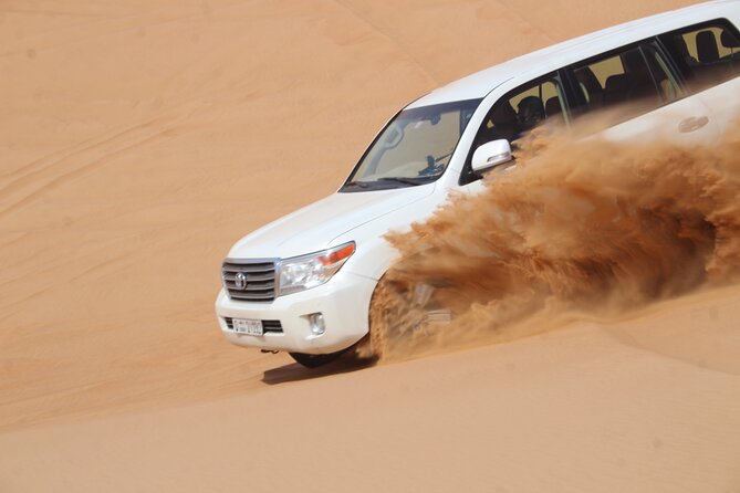 Dubai: Jeep Desert Safari, Camel Ride, and Quad Bike Tour - Dune bashing in a 4x4 Jeep