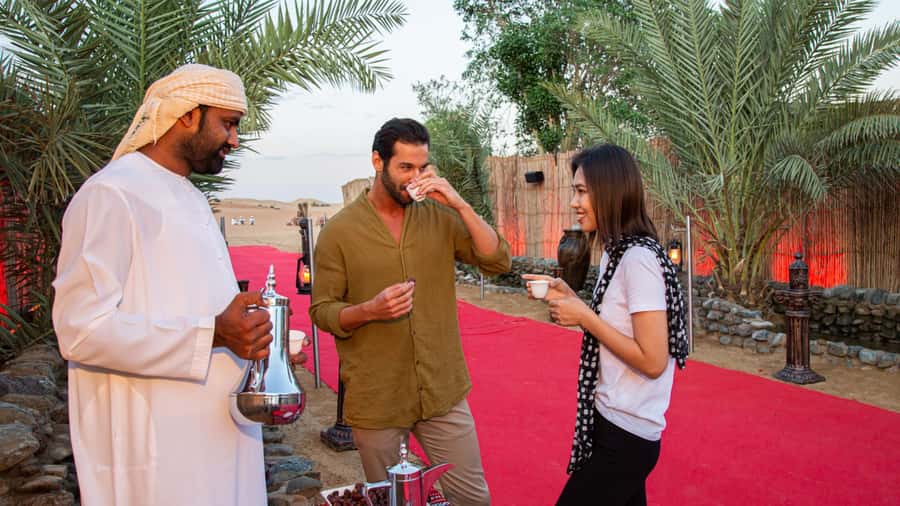 Dubai: Premium Desert Safari, Camel Ride, BBQ & Sandboarding - Belly dancing, Tanoura, and a fire show