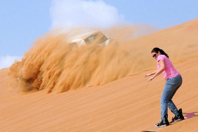 Dubai Private Morning Desert Safari: Camel Ride & Sandboarding - Sandboarding down the red dunes