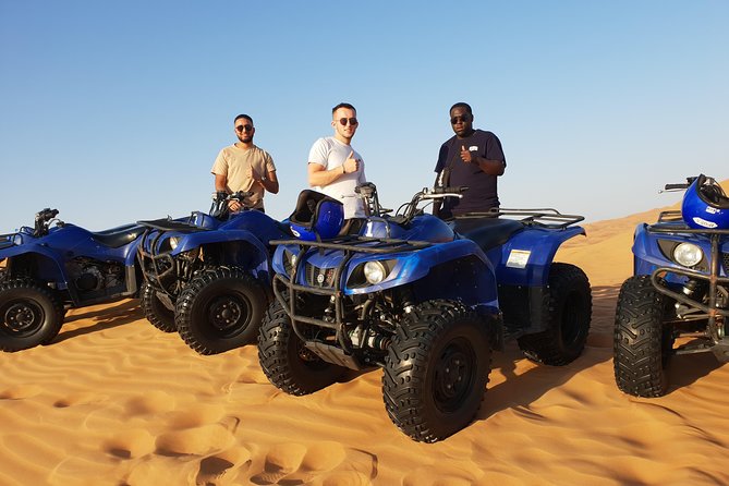 Dubai: Quad Bike Safari, Camels, & Camp with BBQ Dinner - Sunset at the Bedouin-style camp
