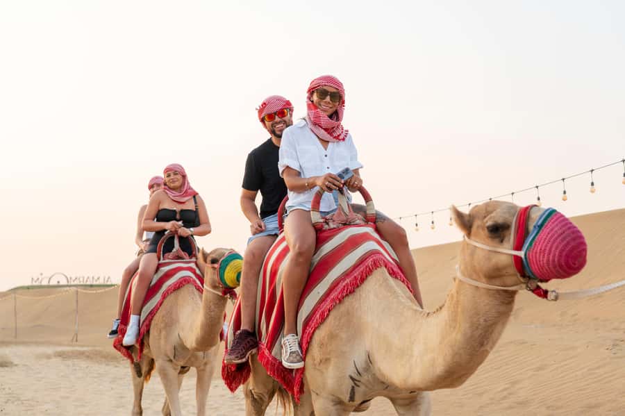 Dubai: Red Dune Desert Safari, Quad Bike, Camels, and BBQ - From your Dubai hotel to the open desert