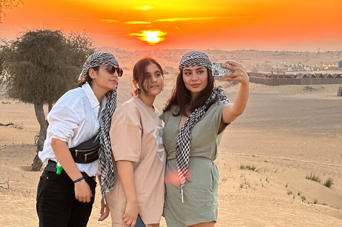 Dubai Sunset Red Dune Desert Safari, Sandboarding and Camel Ride - Sandboarding on the dunes