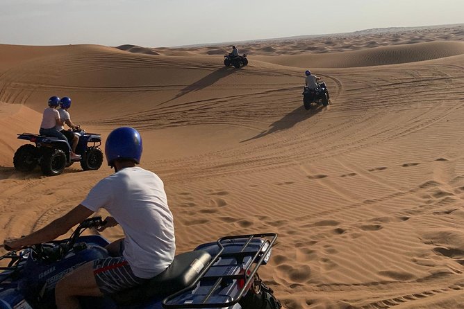Dubai: Unique SUNSET Quad Bike Red Dunes Safari - Sunset from a high dune