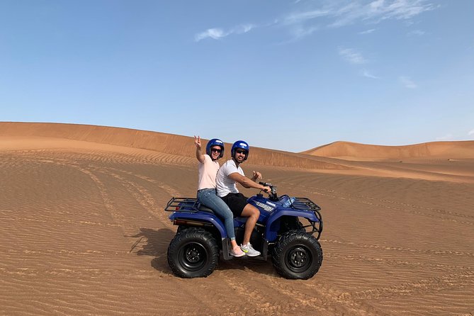 Dubai: Unique SUNSET Quad Bike Red Dunes Safari - BBQ dinner at the traditional camp