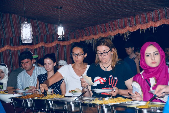 Evening Desert Safari Abu Dhabi with Hot BBQ Dinner - Sandboarding, skiing, henna, and camp photos