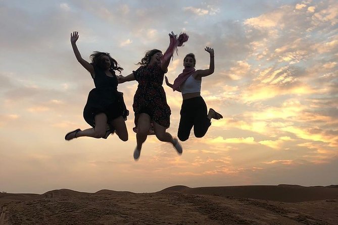 Evening Desert Safari & BBQ With Live Shows,Camel Ride,Falcon pic - The camp adds Arabic touches, with a busy evening feel