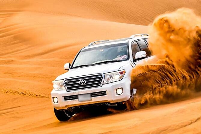 Evening Desert Safari Dubai with Camel Riding & BBQ Buffet Dinner - Lahbab dune bashing with an experienced driver
