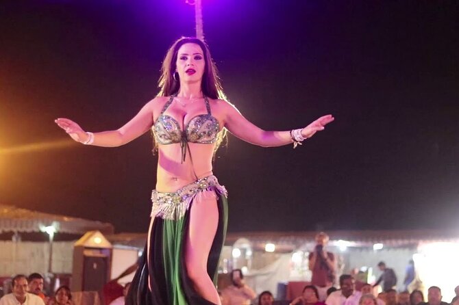 Evening Desert Safari with Belly Dance and BBQ Dinner and Camel Ride - Tanoura dancing, music, and fire