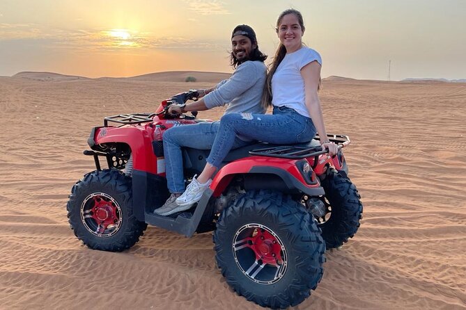 Evening Red Dunes Safari with Quad Biking, BBQ Dinner & LiveShows - Belly Dancing, Tanoura, and Fire Performances