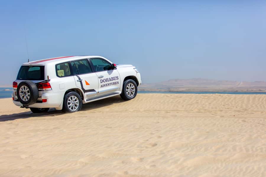 From Doha: 8-hour Safari Tour with Desert Beach Experience - From Doha streets to open desert