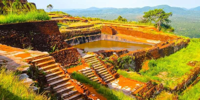 From Negombo: Sigiriya and Dambulla Day Trip and Safari - Dambulla Cave Temple before the worship break