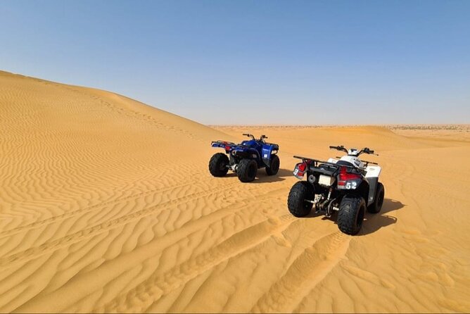 Guided Desert Safari with Dinner and Quad Biking in Dubai - Lahbab’s red dunes and 4x4 dune bashing