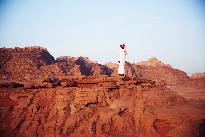 Half-Day Jeep Safari "Wadi Rum Highlights!" w/ Professional Bedouin Guide - Riding across Wadi Rum in an open-backed Jeep