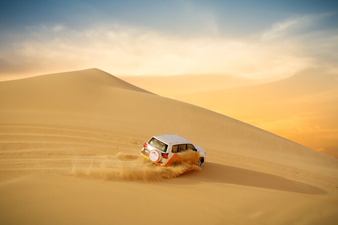 Morning Desert Safari From Abu Dhabi - Sand boarding near the camp
