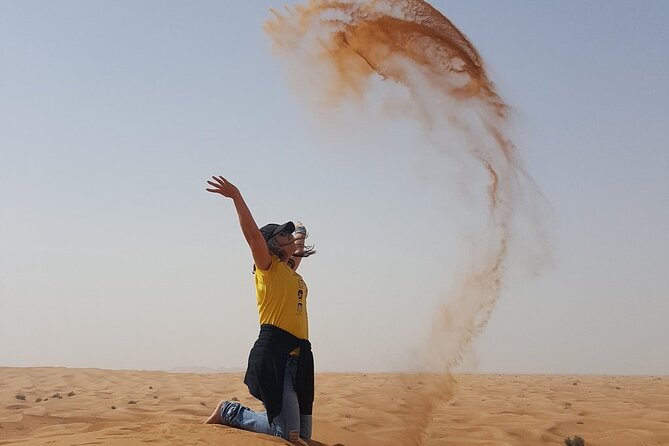 Morning Dubai desert safari - camel rides, quad bikes, dune buggies,dune bashing - Sandboarding gives the dunes a quieter moment