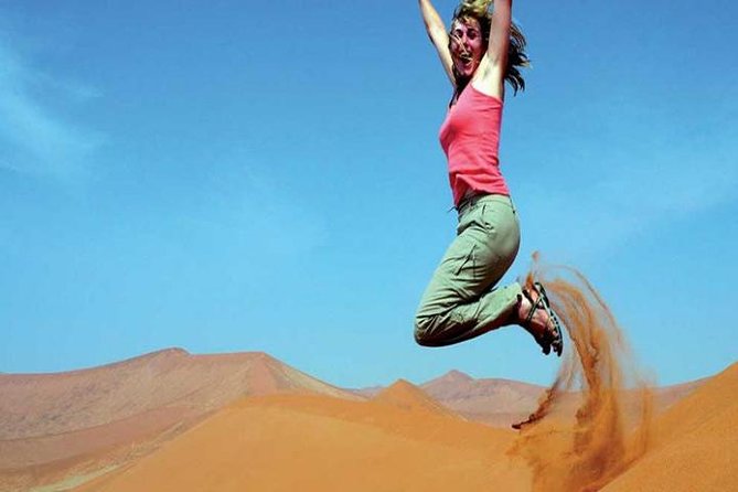 Morning Red Dunes Safari: Camel Ride & Sandboarding Adventure - Photo stops, drinks, and the human side of the tour