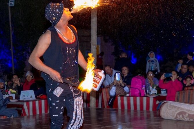 Premium Desert Safari, food Service with 4 alcoholics drinks - Camel Riding, Sandboarding, and Camp Activities