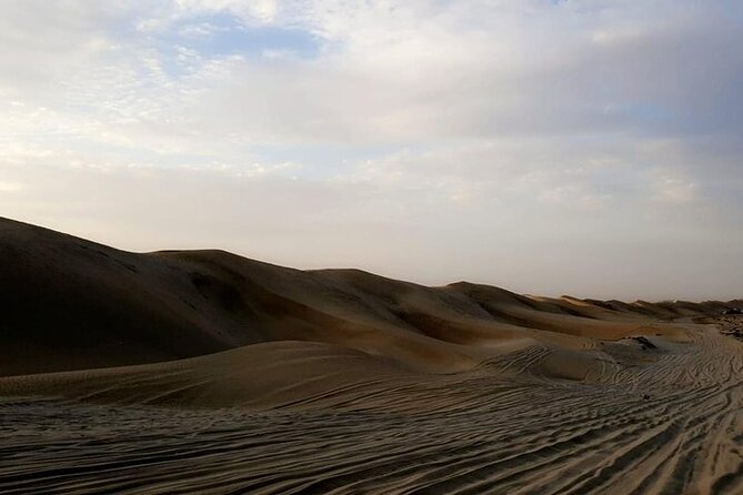 Qatar Sunset Desert Safari: Dune Bashing & Golden Sands Adventure - Sunset beside Khor Al Adaid and the Saudi border