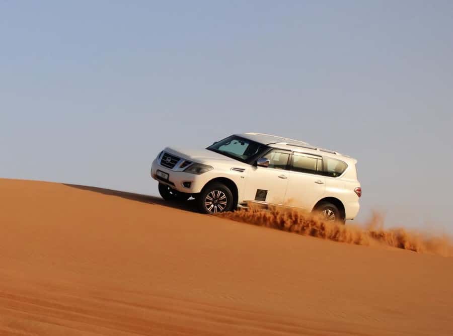Qatar: Sunset Desert Safari with Camel Ride & Sandboarding - Sandboarding on the dunes