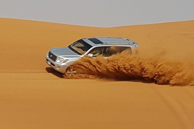 Red Dunes Desert Safari with BBQ Dinner - Leaving Dubai for the red dunes