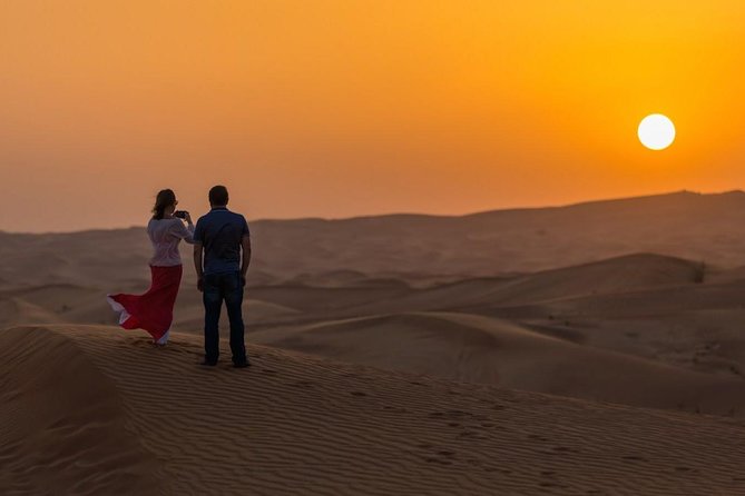 Red Dunes Desert Safari with BBQ Dinner - Sandboarding and the sunset photo stop
