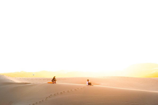 Sunrise Desert Safari in Qatar: An Unforgettable Adventure - Sandboarding on the golden slopes