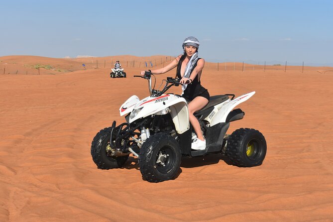 Sunset Desert Safari Quad bike Camel ride Sand Board & BBQ Dinner - Dune bashing and the sunset photo stop