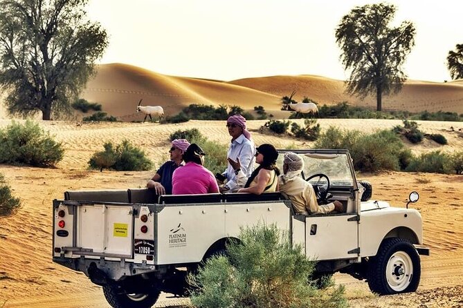 Thrilling Desert Safari Dubai Adventure with Sand Boarding and Barbecue Dinner - Sandboarding on a high dune