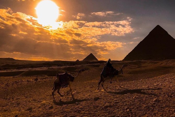 Unusual Desert Safari Tour Around Giza Pyramids During Sunset With Barbecue. - Riding through the desert with the pyramids in view